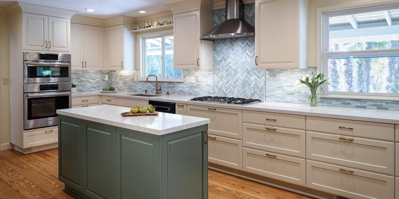 two-tone-kitchen-green-island-white-upper-and-lower-cabinets-wood-floor-1600x1040